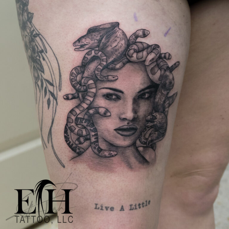 womans portrait as medusa with eels tattoo on front thigh - endless heights tattoo by artist dj donald voelker