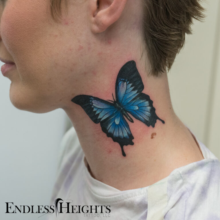 butterfly effect, a blue butterfly on the side of her neck - endless heights tattoo by artist dj donald voelker