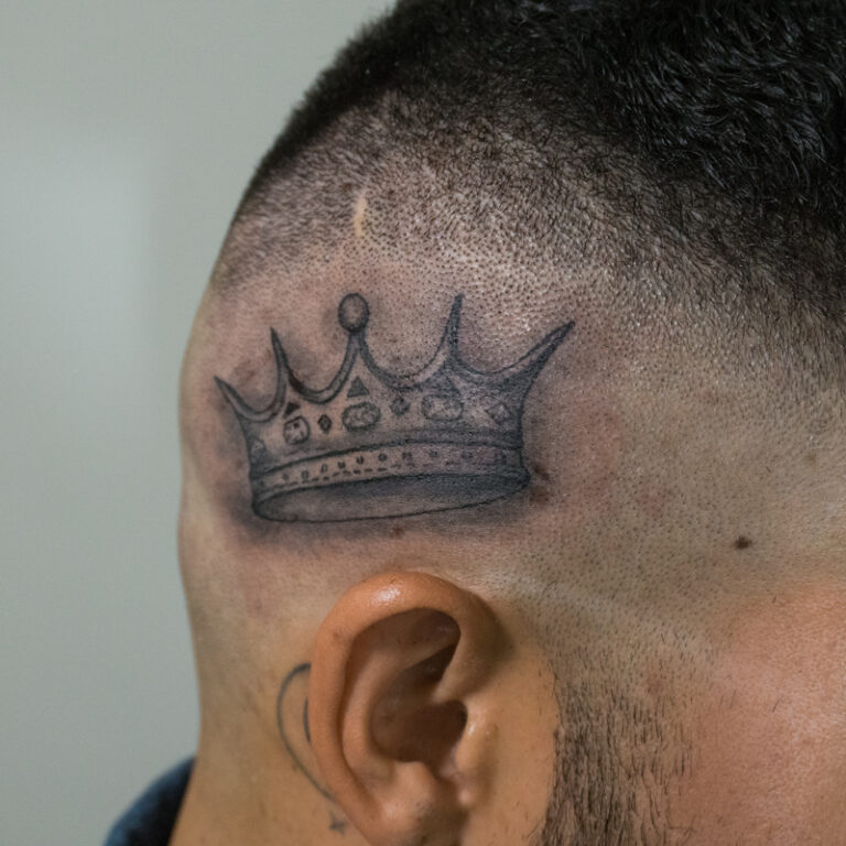 crown on side of his head tattoo - endless heights tattoo by artist dj donald voelker