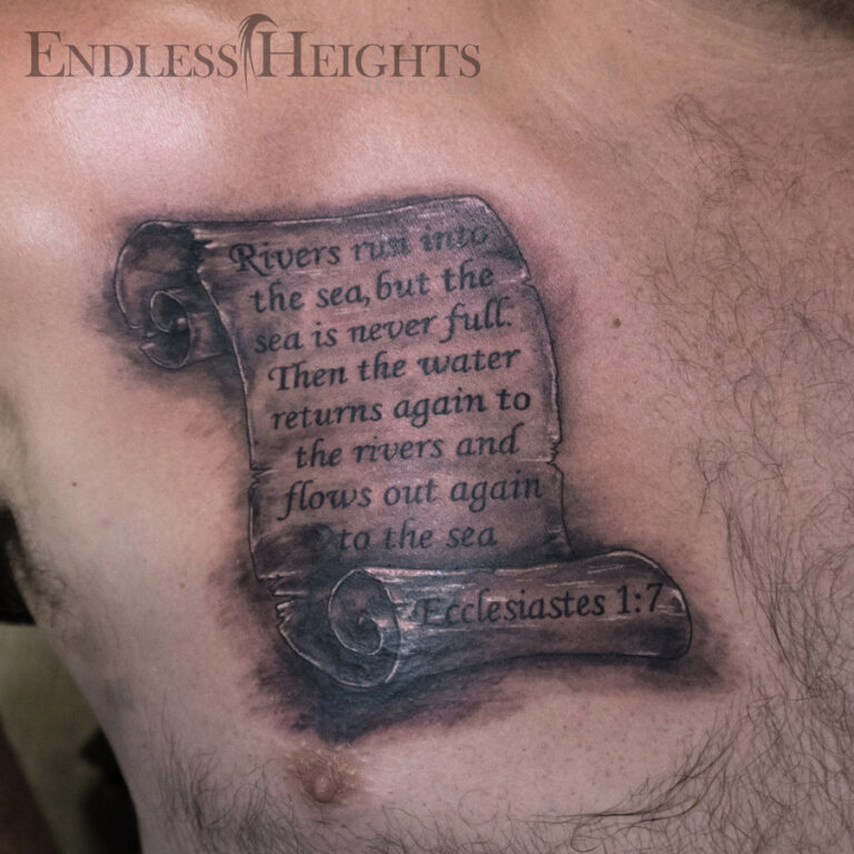 scroll with scripture tattoo coverup on the chest - endless heights tattoo by artist dj donald voelker