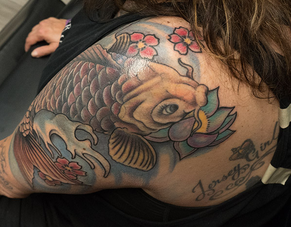 endless heights tattoo, artist dj voelker, portfolio images traditional koi and lotus revamp tattoo - endless heights tattoo by artist dj donald voelker