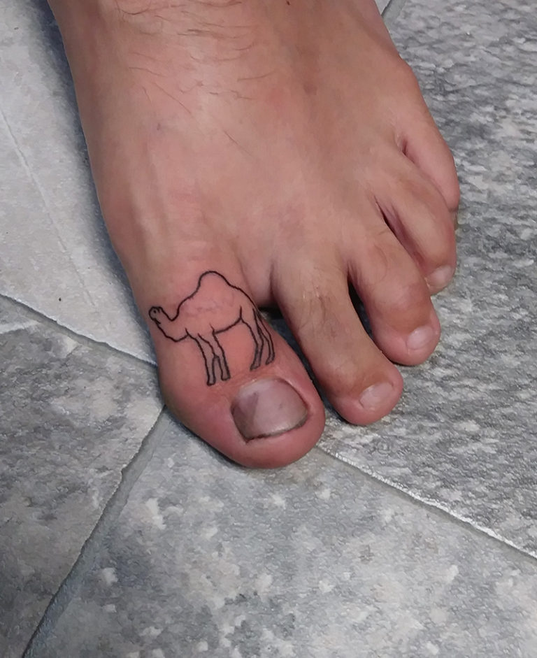 camel outline linework tattoo on the top of big toe - endless heights tattoo by artist dj donald voelker