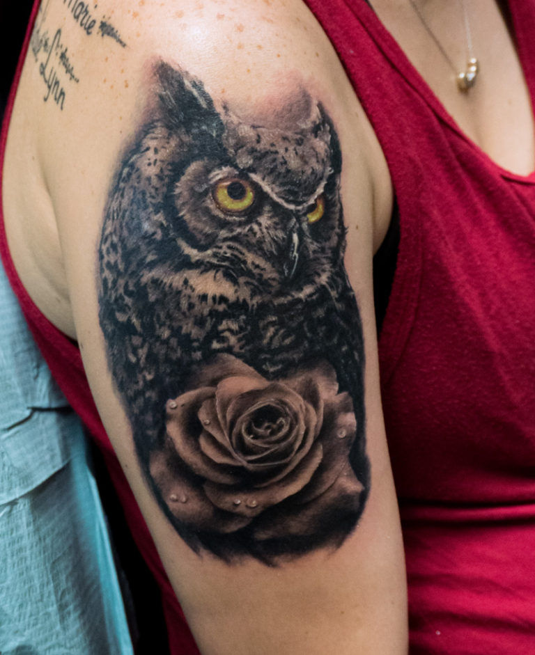 realism black and grey owl and rose tattoo - endless heights tattoo by artist dj donald voelker